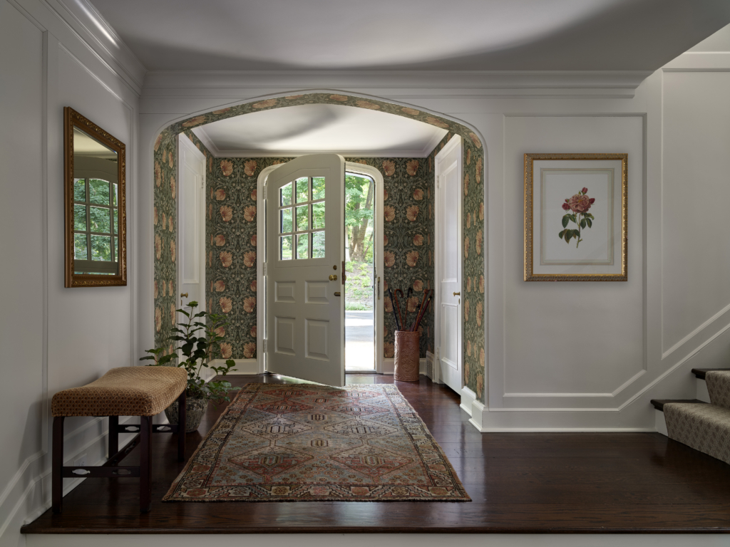 A front entryway with William Morris & Co. Pimpernel wallpaper