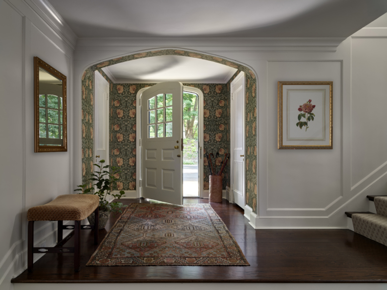 A front entryway with William Morris & Co. Pimpernel wallpaper