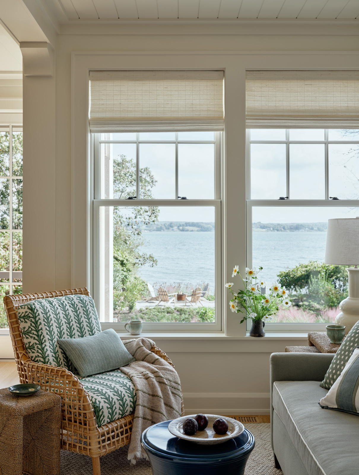 A green and white breakfast nook with water views