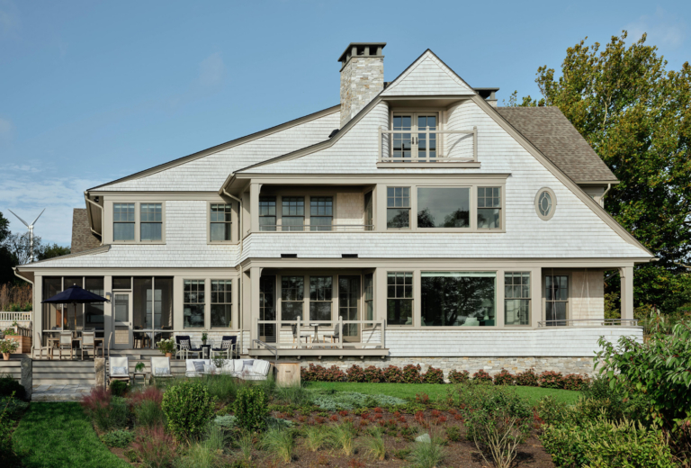 The back exterior of a contemporary shingle-style home.