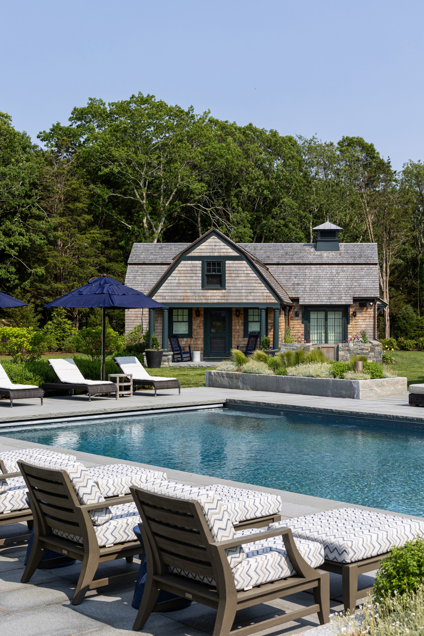 A pool and guest cottage in coastal Rhode Island