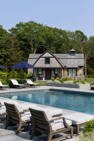 A pool and guest cottage in coastal Rhode Island