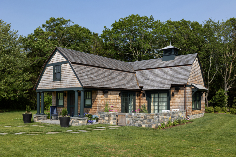 A shingle-style guest cottage