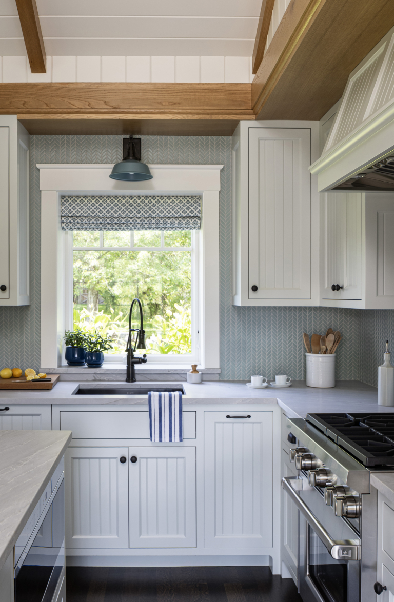 A cottage kitchen with white cabinetry