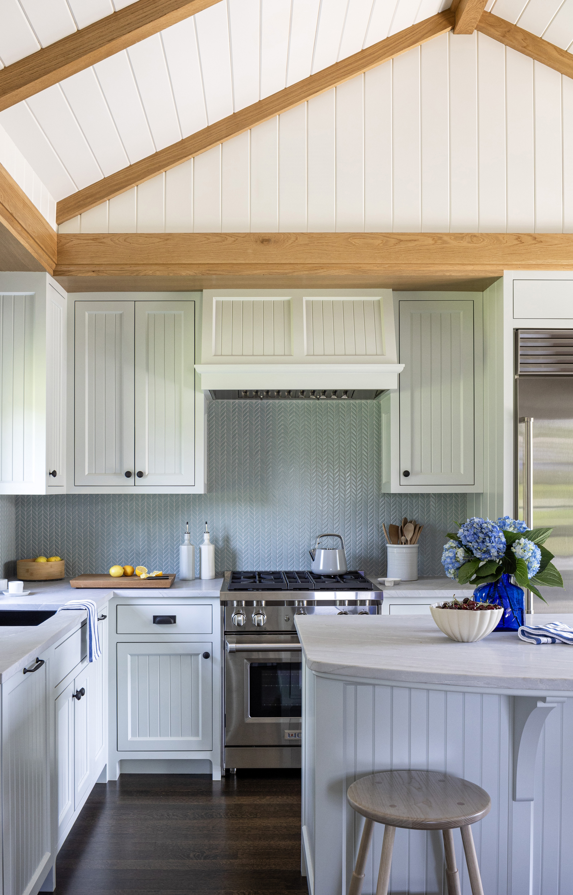 A guest house cottage kitchen with light blue backsplash