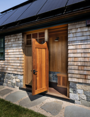 A shingle-style outdoor shower