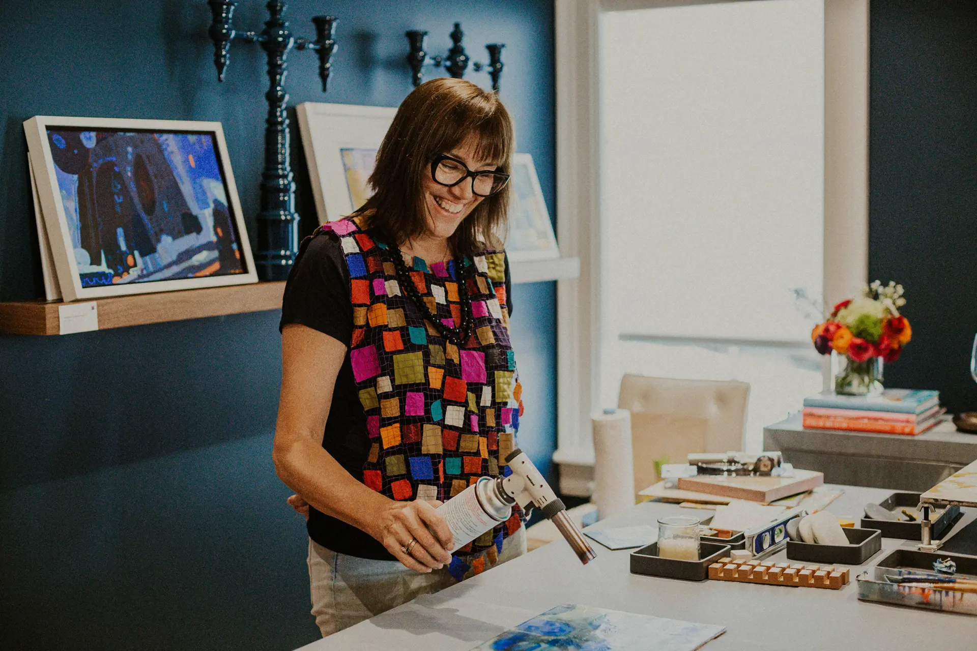 Kelly Milkus creating an encaustic painting